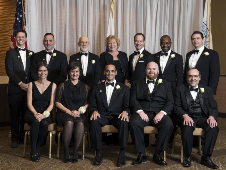 The Mayor and City Council (as pictured in 2018). From left to right first row: Stephanie Hirsch, Katjana Ballantyne, Mayor Joe Curtatone, Matt McLaughlin, Bill White. Second Row: Ben Ewen-Campen, Jesse Clingan, Mark Niedergang, Mary Jo Rossetti, Lance Davis, Will Mbah, and J.T. Scott.